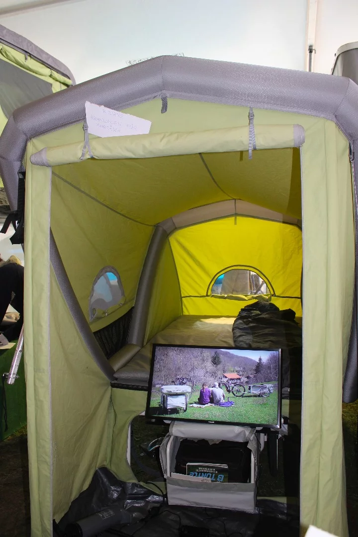 The B-Turtle tent includes a standing height annex room with a roll-up door and zippable panel access to the trailer's storage compartment