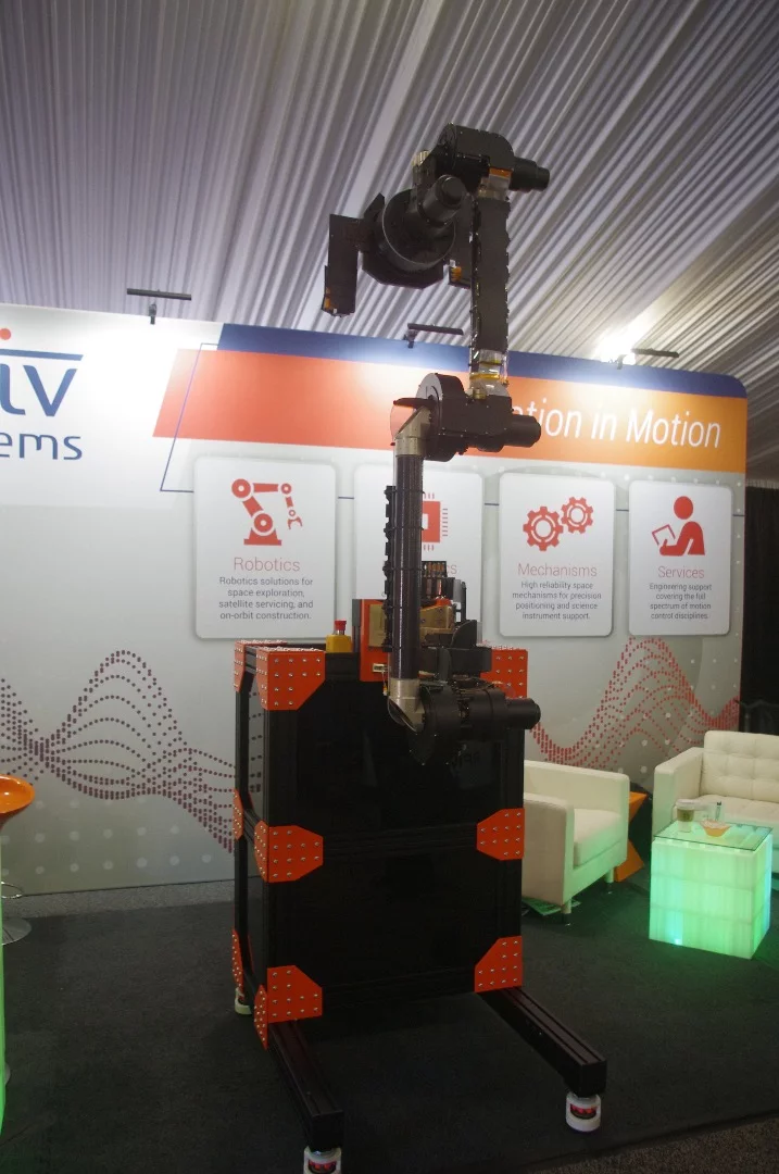 An exact replica of the Mars 2020 Robotic Arm, which will be made out of titanium, not plastic as seen here. The arm, made by Motiv Space Systems, will be attached to the Mars 2020 Rover and will carry a mass spectrometer, cameras and a drill with an extraction bit.