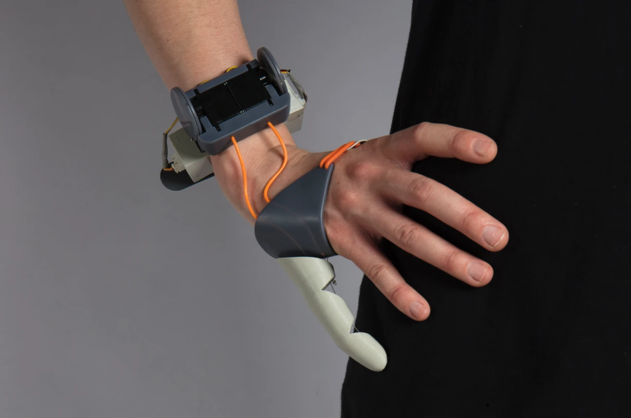 The thumb is 3D printed from a flexible filament called Ninjaflex