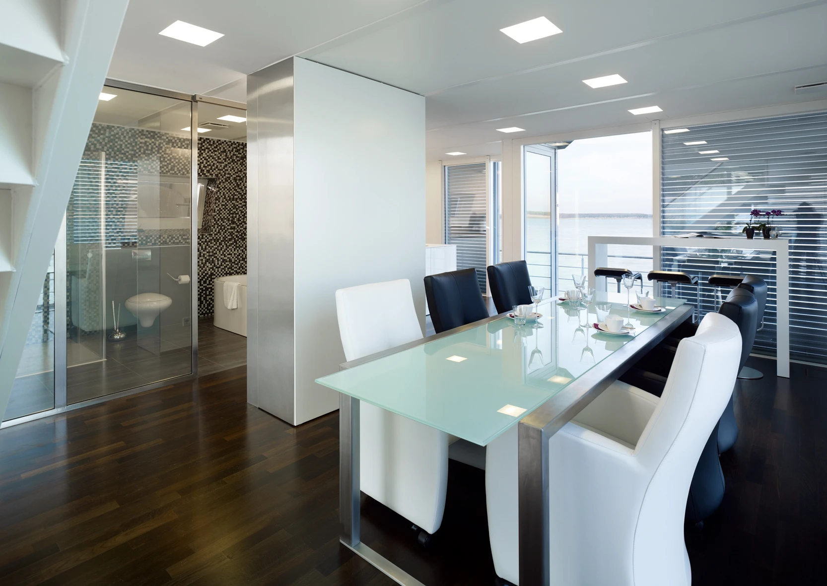 An automated roof-light control system allows natural light to filter through the home