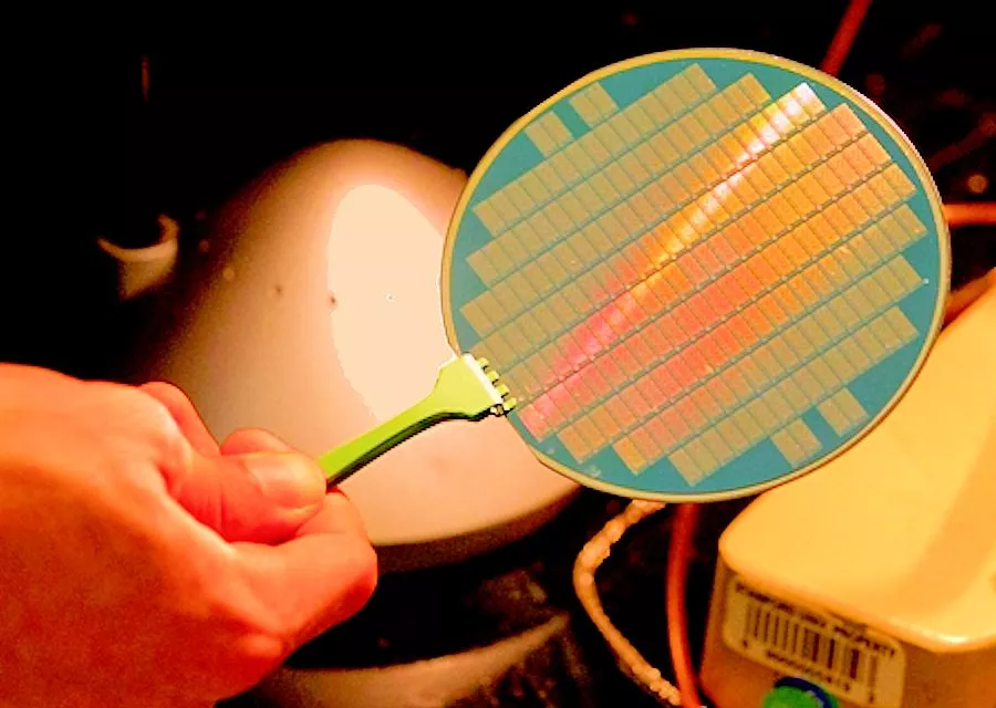Photo of a silicon wafer on which have been grown a number of CNT-based computer chips (Photo: Norbert von der Groben/Stanford)