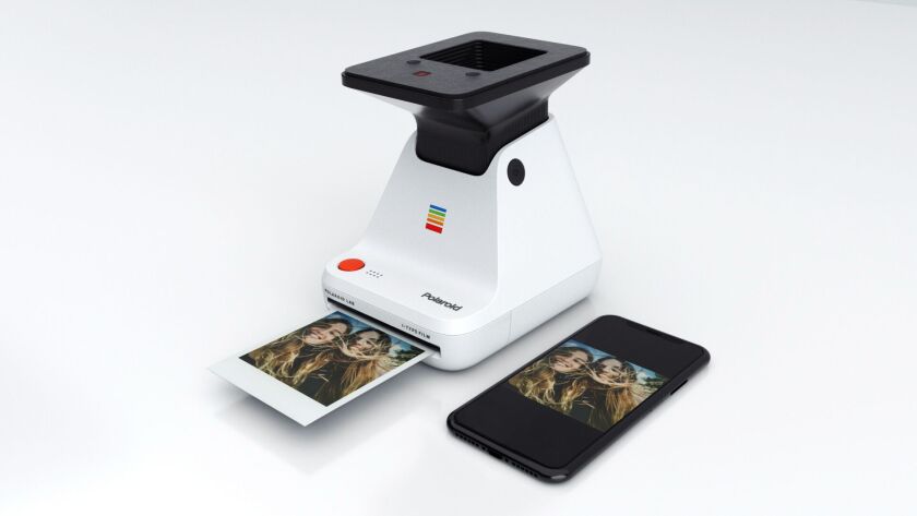 Placing a smartphone on top of the cradle and pushing the red button results in an instant photo being printed