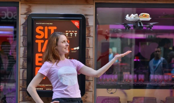 UK-based restaurant Yo Sushi outfitted a quadcopter with a food tray and is having waiters fly it to tables using an iPad