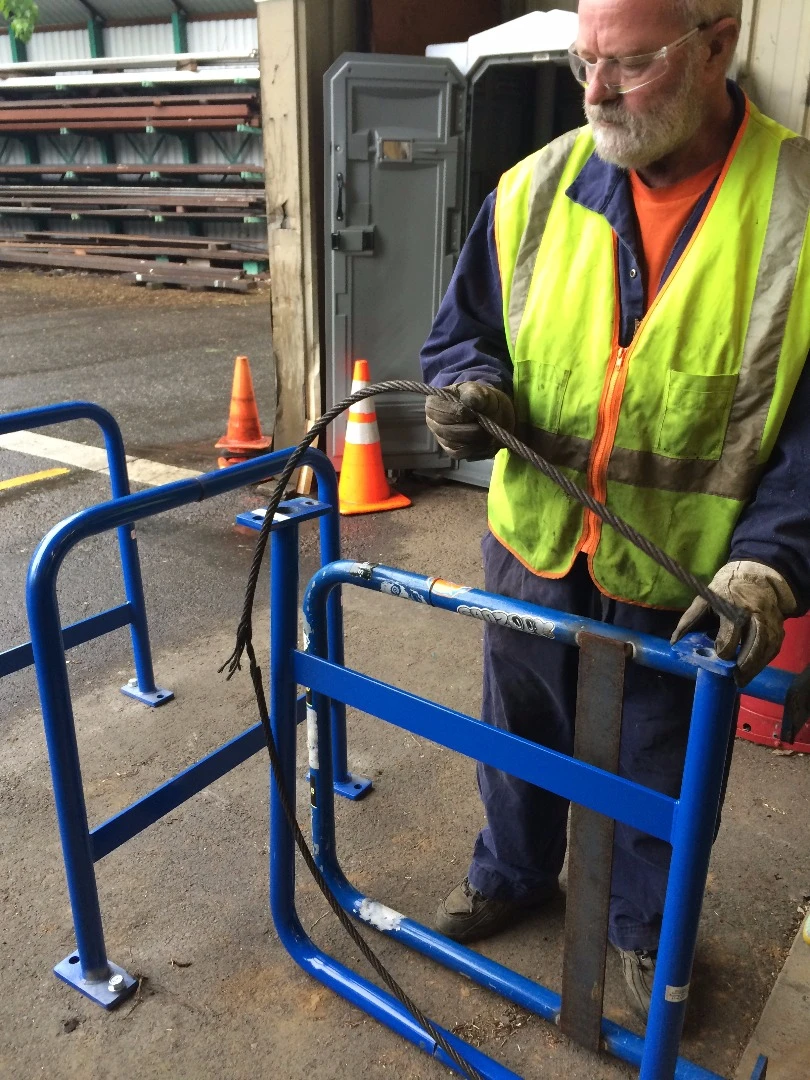 Inside of the rack's piping runs a length of free-floating steel wire cable
