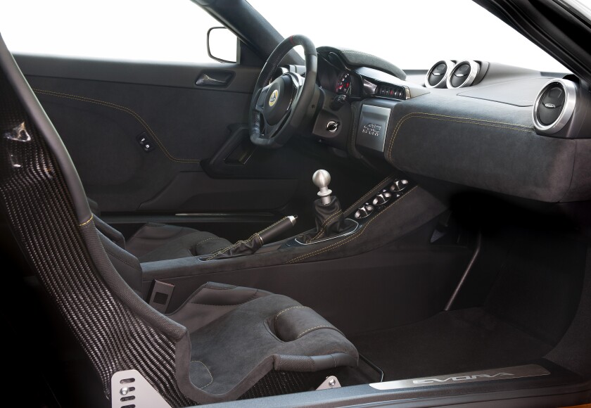 A Spartan-like interior features race-inspired sports seats, but no armrests