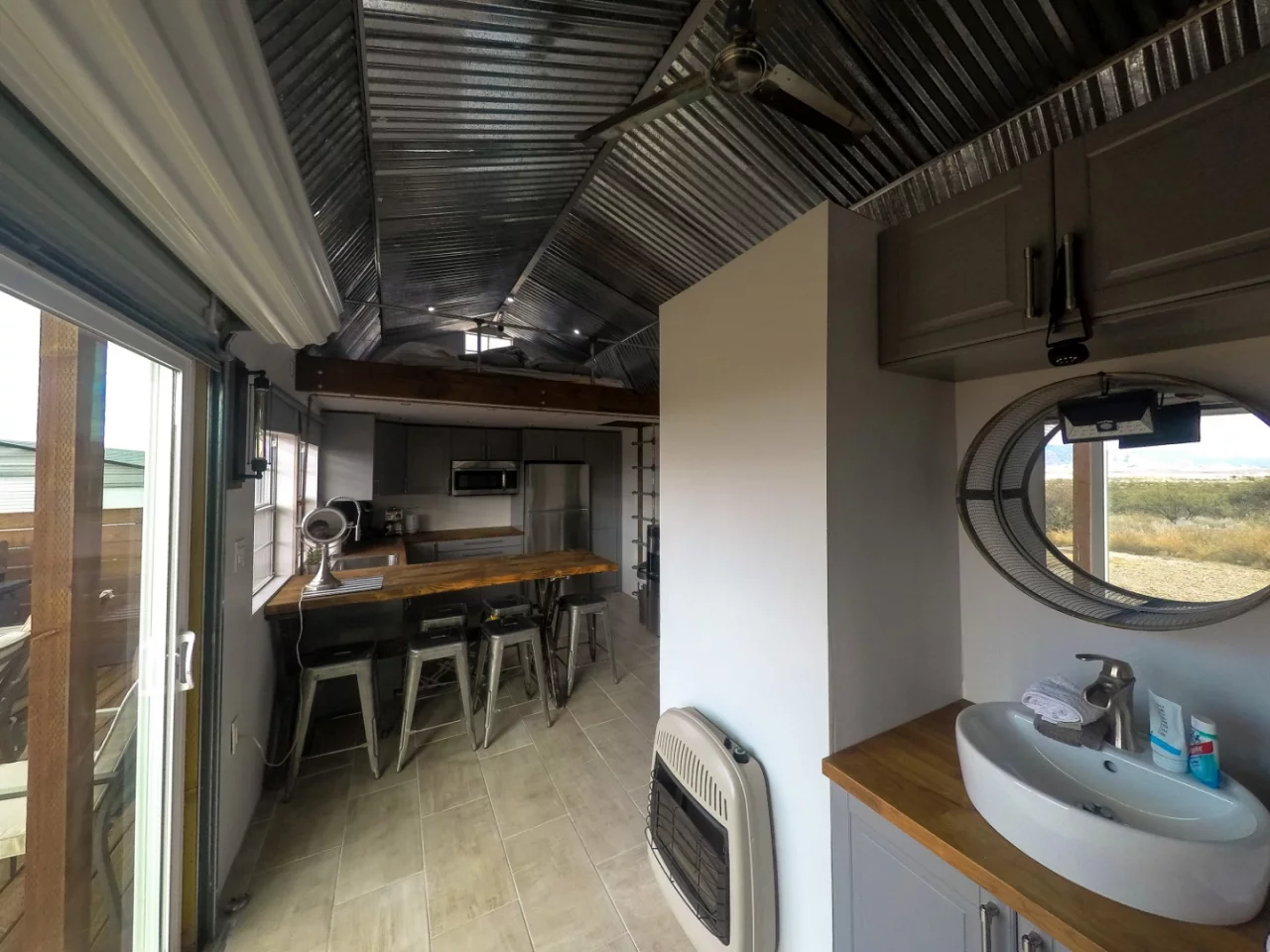 Looking towards the kitchen from the living room, you can see that there's plenty of living space. Modern, sleek, and efficient. You can also see the second loft above the kitchen.