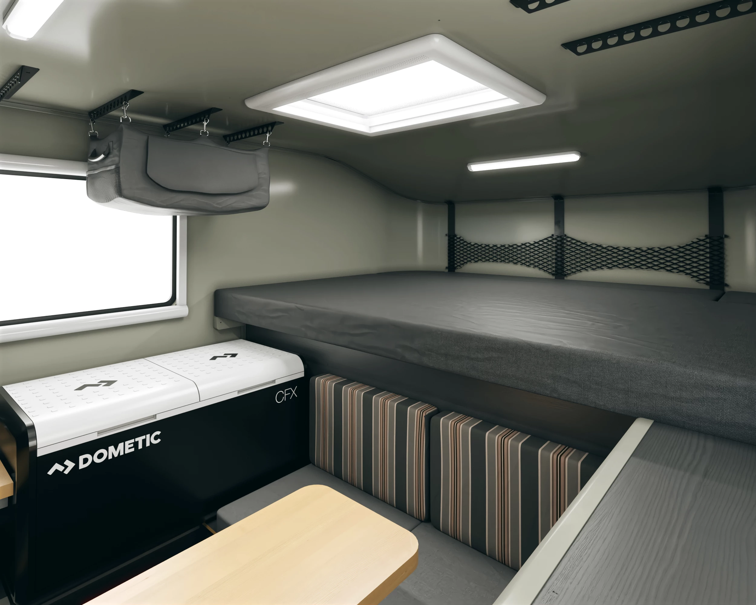 Inside, the Kenai sleeps campers on a queen bed up high and convertible dinette bed down low