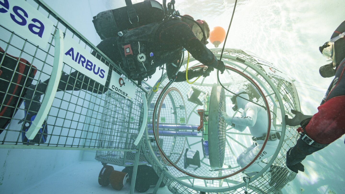 Divers assisting in the airlock tests