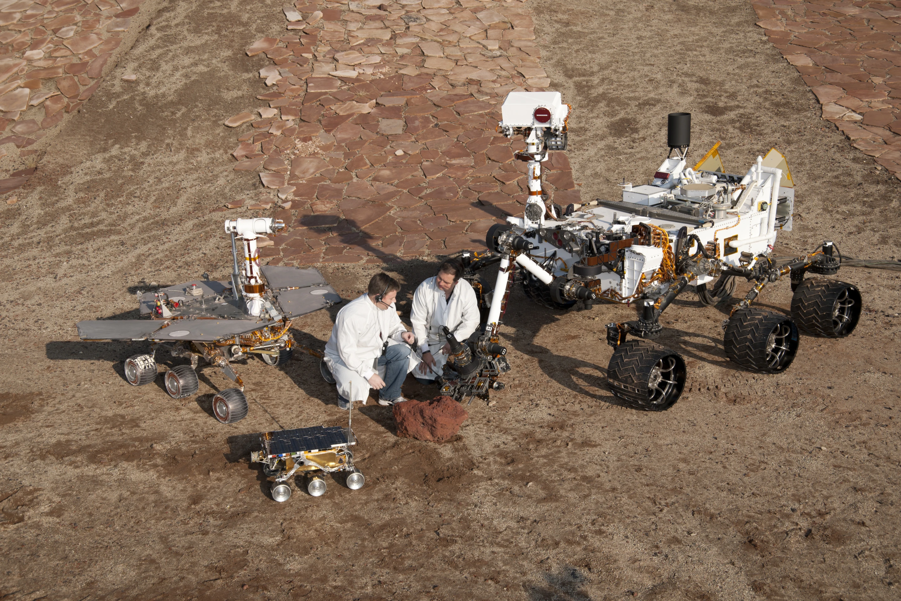 Clockwise from the bottom, Sojourner, Opportunity, and Curiosity