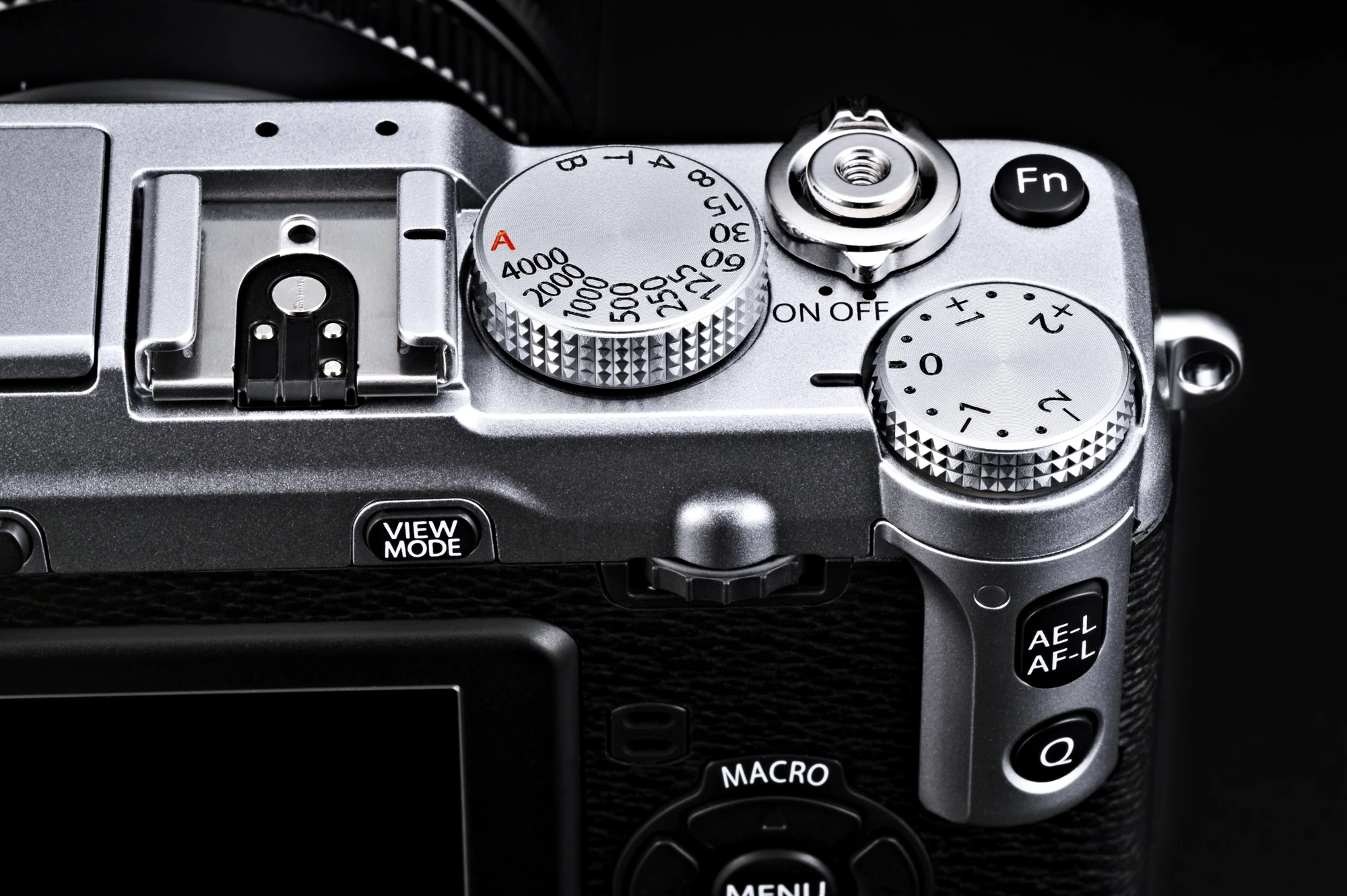 Manual control dials for shutter speed and exposure feature on the top panel of the Fujifilm X-E1 along with a Fn (Function) button