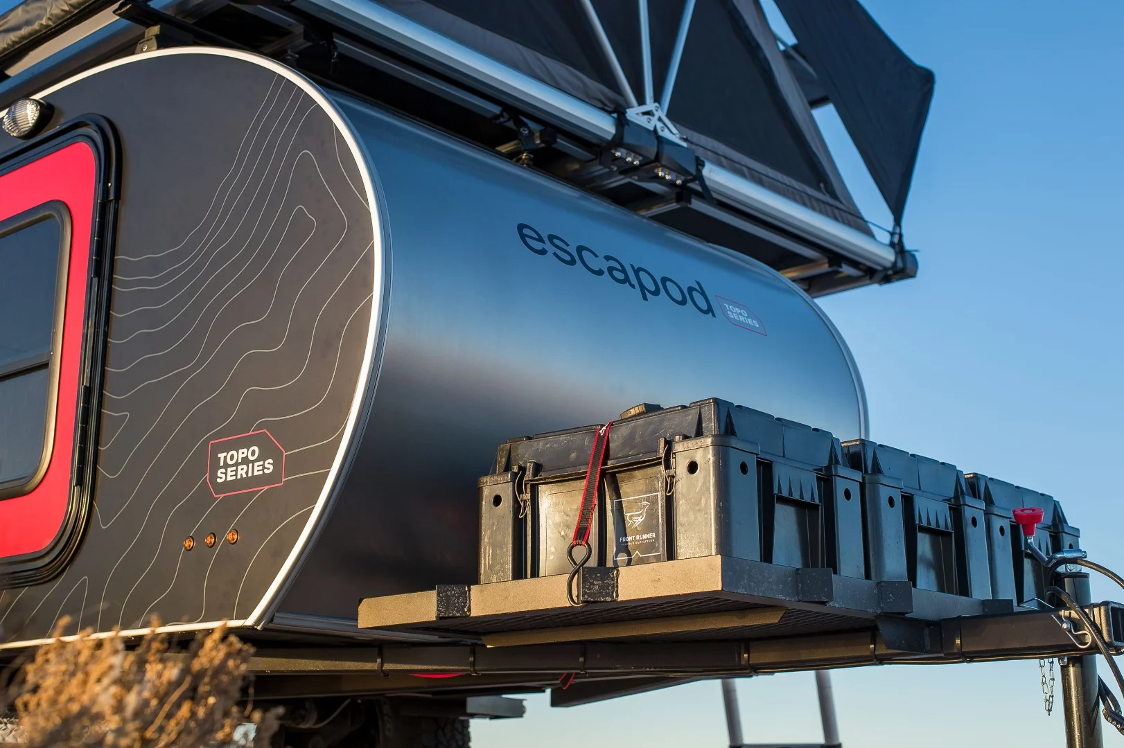 The tongue rack holds three Front Runner Wolf Pack boxes neatly