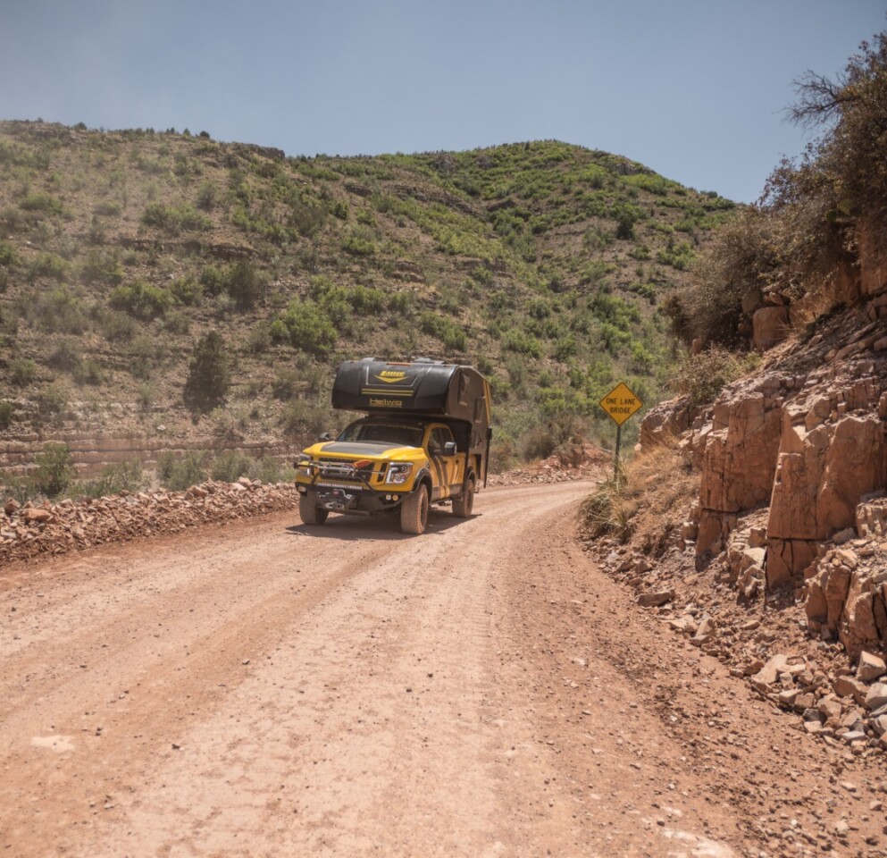 A bit bulkier than the Mountain Patrol, the Hellwig/Lance Titan XD pickup camper is still quite at home on the dirt and rock