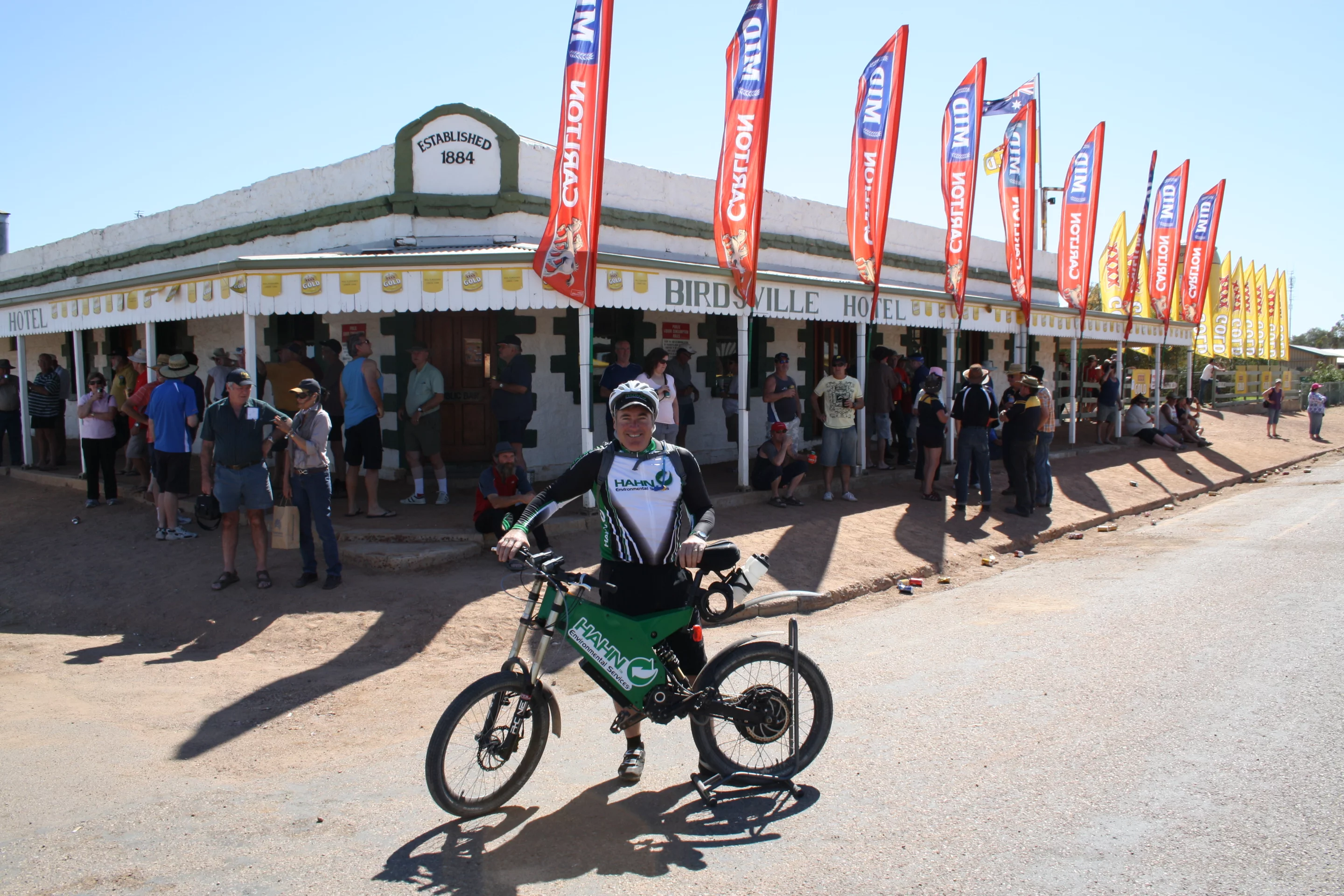 Allan Lear poses with his Stealth Bomber at the finish line in Birdsville after pedaling 1629 km in seven days