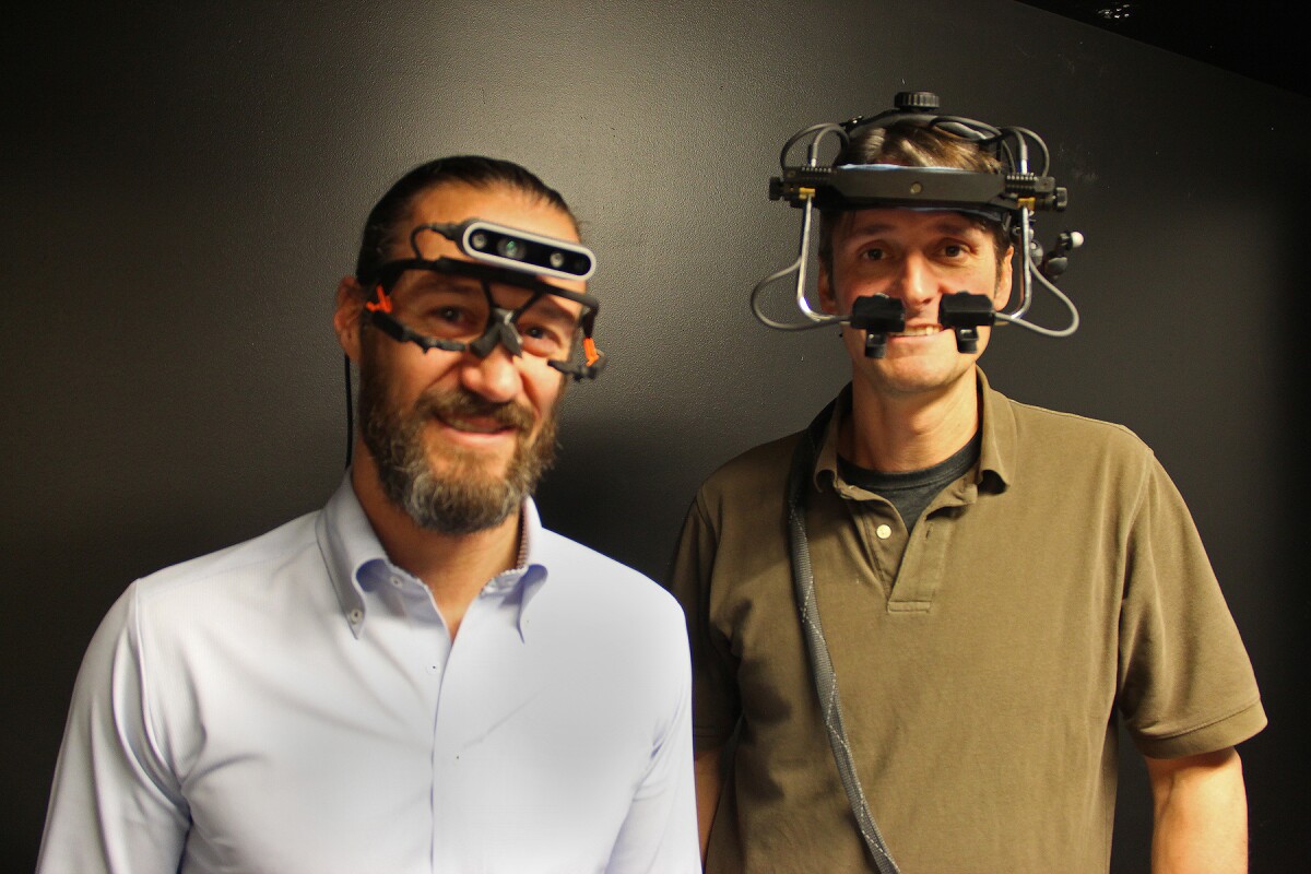 Asst. Prof. Mark Lescroart (left) and Asst. Prof. Paul MacNeilage, with two versions of the headset