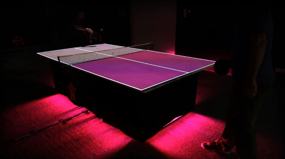 Pingtime augments an ordinary table tennis table with projections and sounds by equipping the paddles with sensors and using an infrared camera to track the ball (Video still: videogram)