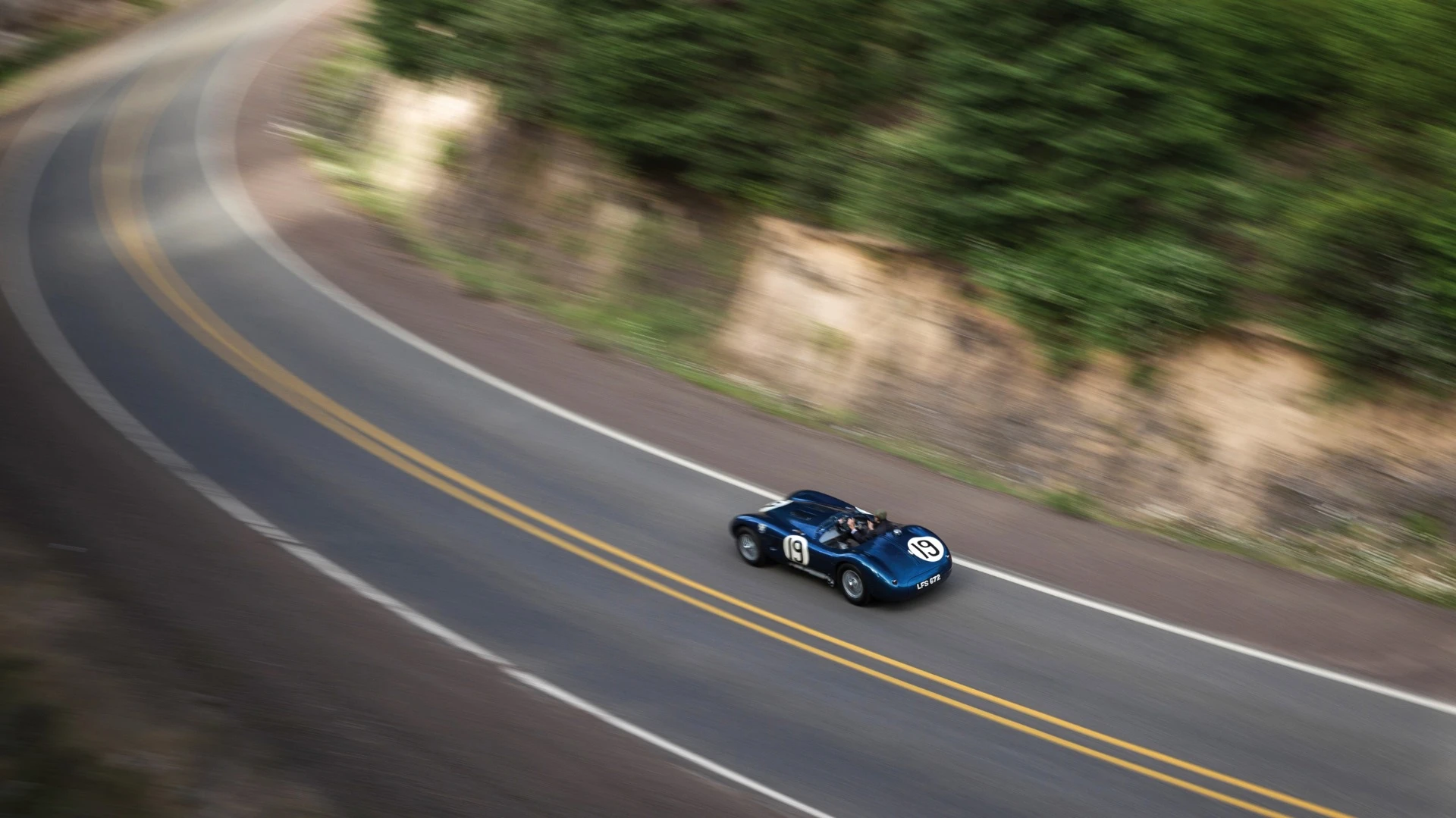 There were just 53 C-Type Jaguars built. Three lightweight works cars (of which this car is one), and a run of 50 cars to satisfy customer demand after the factory cars finished first, second and fourth in the 1953 Le Mans 24 Hour event. The biggest difference to the competition were the disc brakes. Endurance racing was born to demonstrate reliability and validate new automotive technologies for the masses and just as it has done more recently with hybrid and diesel drivetrains, Le Mans heralded the coming of age of a new braking technology with this car and its works siblings. The winning C-type was the first to average more than 100 mph for the 24 Hours of Le Mans (105.8 mph, 170 km/h), and this car, which finished fourth, also broke the ton, averaging 104 mph (167 km/h). Equally at home in any of the world’s finest concours or vintage rallies, this car represents a landmark in Jaguar history.