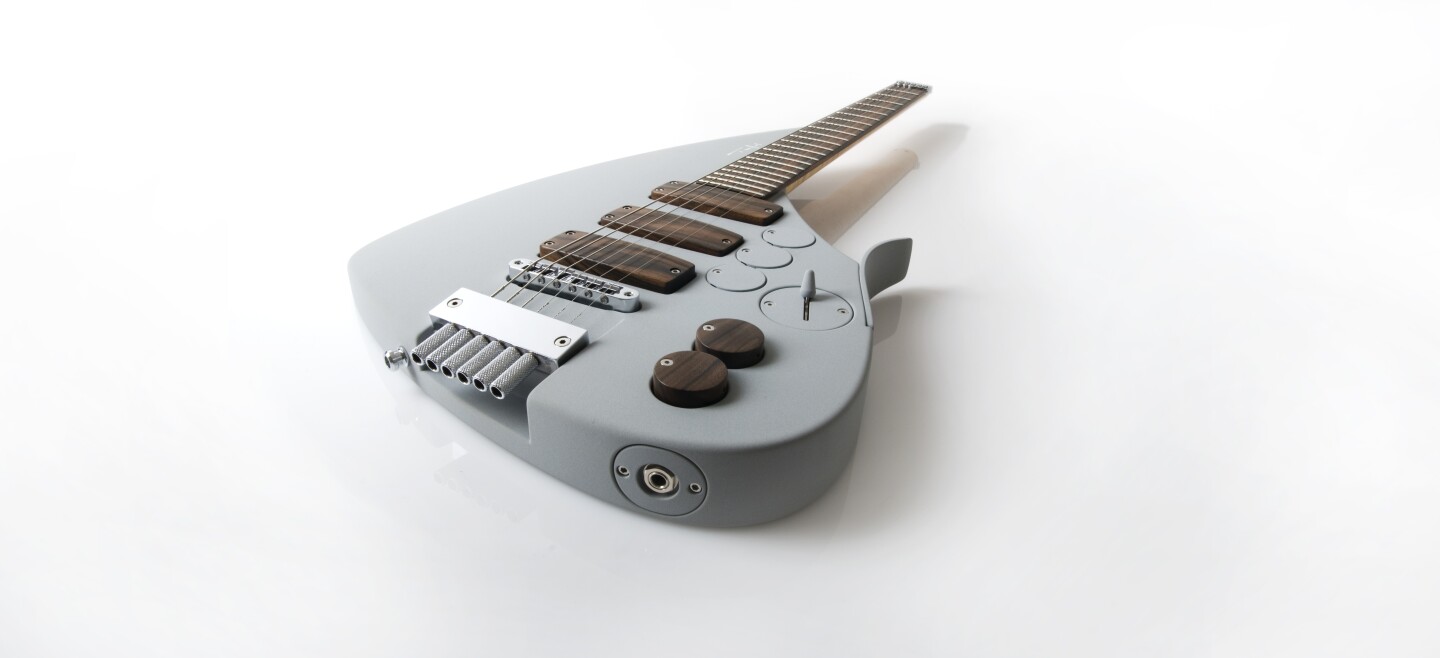 The pickups and controls of the Tesla Prodigy are covered in exotic wood
