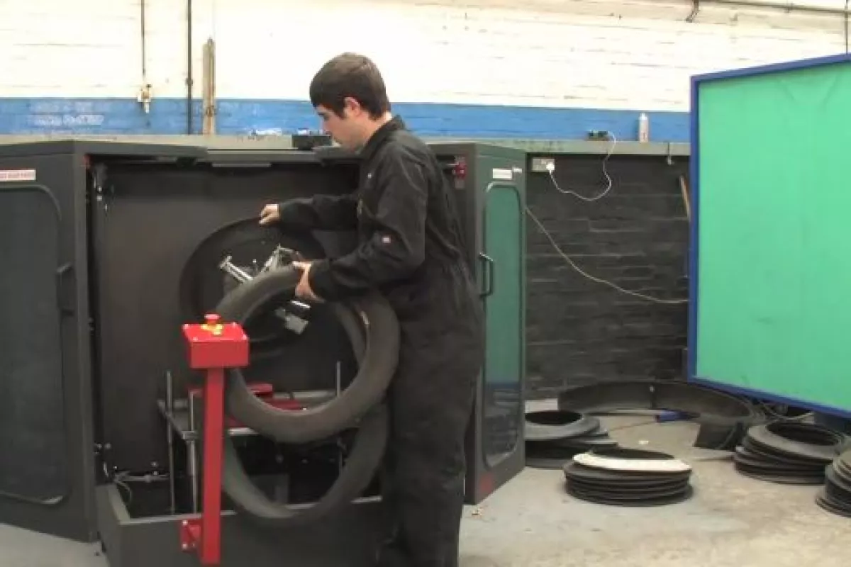 The SymTyre-S300 is a machine that cuts up discarded tires, so they can be flat-packed for more efficient storage and transport