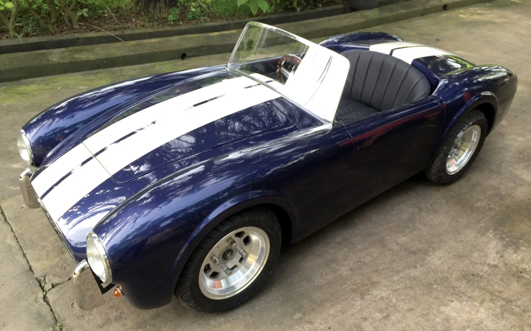 This children's car is powered by a 110 cc engine, steel chassis, fiberglass body and a top speed of a reported 40 mph. The car features fully independent suspension, front and rear disc brakes, working headlights, horn, and electric starter. It sold for $18,000 at RM-Sotheby's Scottsdale 2018 auction.