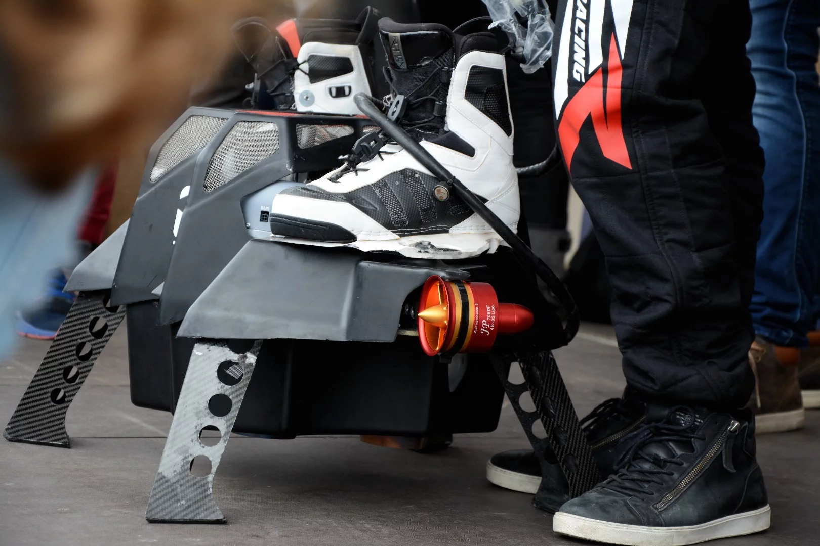 A mercifully quiet jet-powered hoverboard poses for photos after the record-breaking flight on April 30