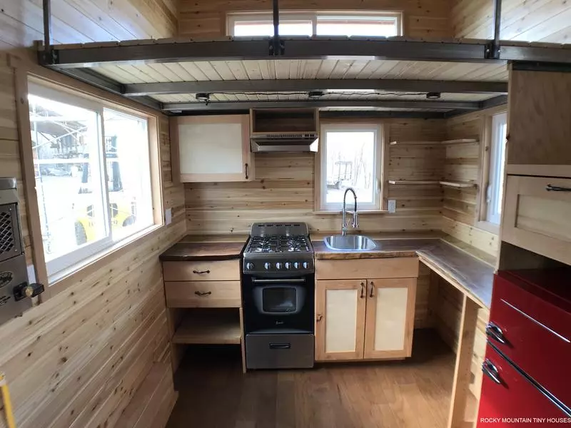 The Rhode Island Red's kitchen includes an oven, sink, mini fridge/freezer and quite a bit of storage space considering its compact dimensions