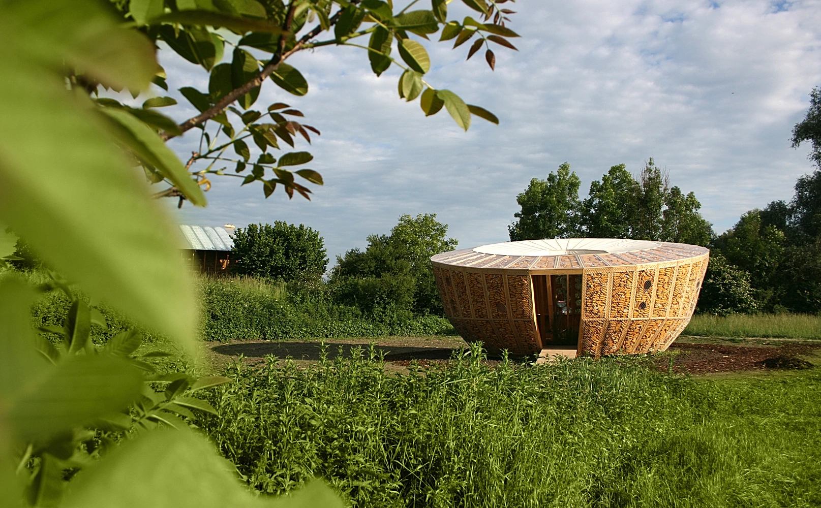 Architectural firm St André-Lang has designed and built a compact circular housing prototype that incorporates corn cobs within the walls