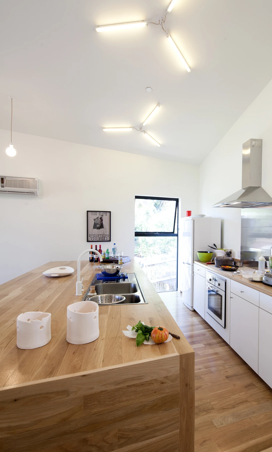 Anonymous Architects employed innovative space saving techniques, and not a little radical interior design