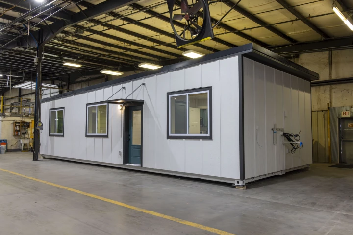 The Double Duo is a shipping container-based tiny house with a spacious layout that contains a pair of bedrooms and bathrooms