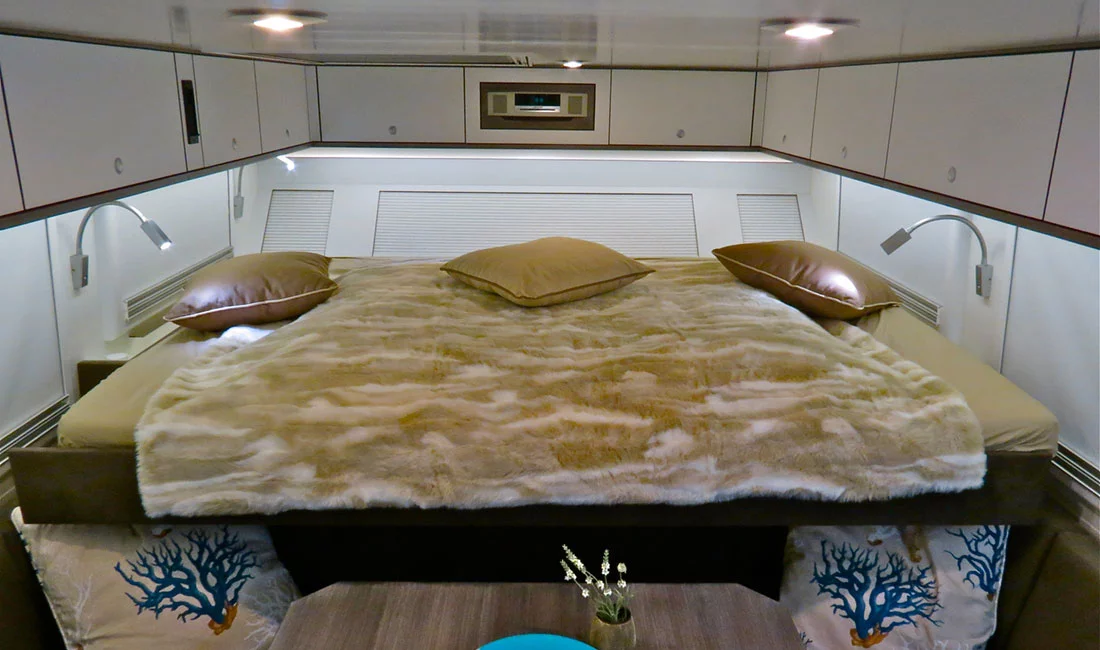 Action Mobil's extendable bed provides room to sleep and shortens up when you need to use the dinette set