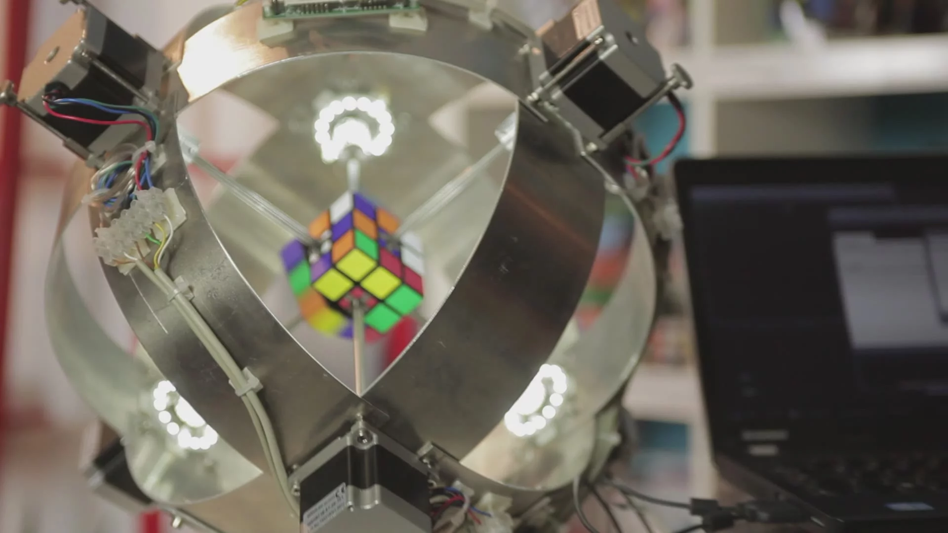 The cube was scrambled by a computer generated random array before being positioned in the robot