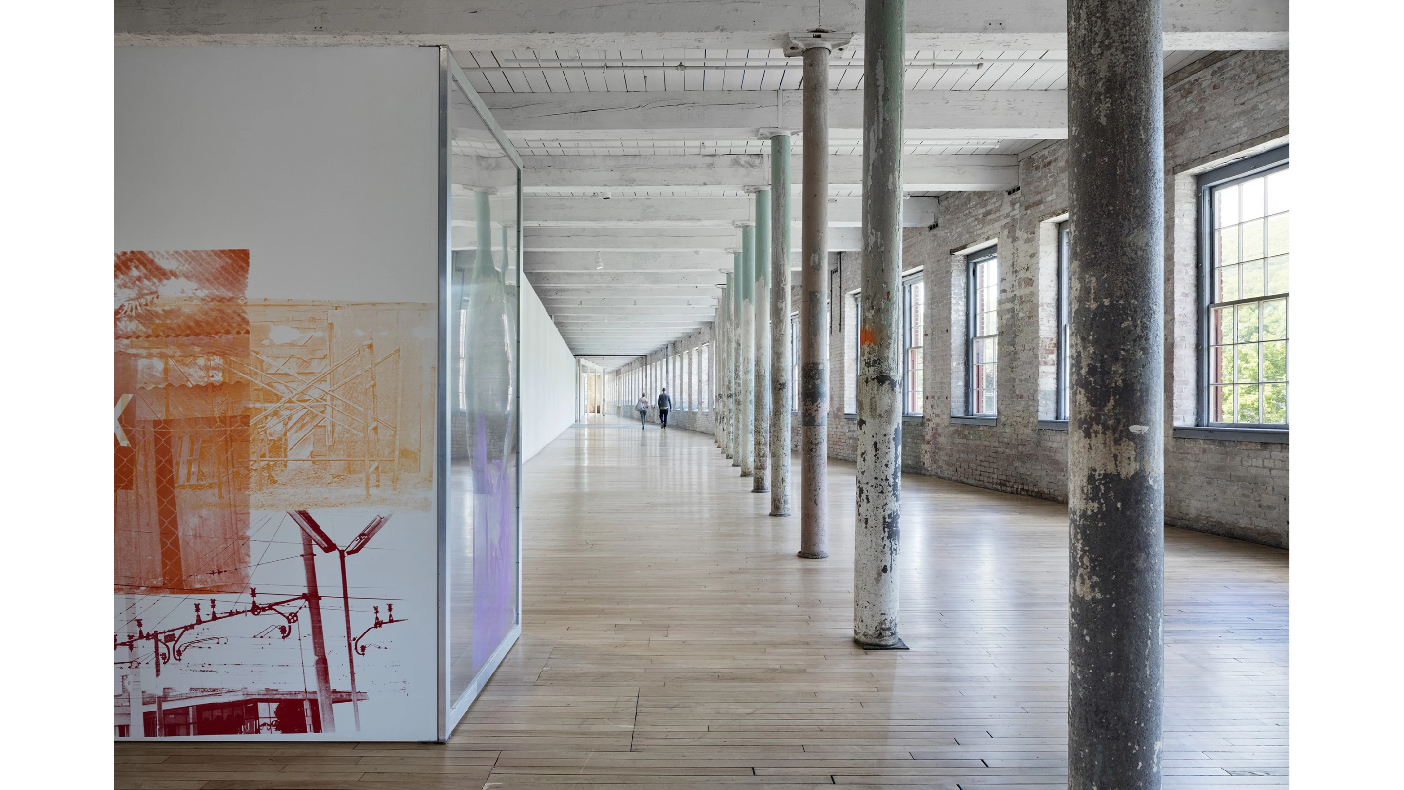 Mass MoCA makes use of the original industrial bricks, columns, and patina to reference the space's previous use as a factory