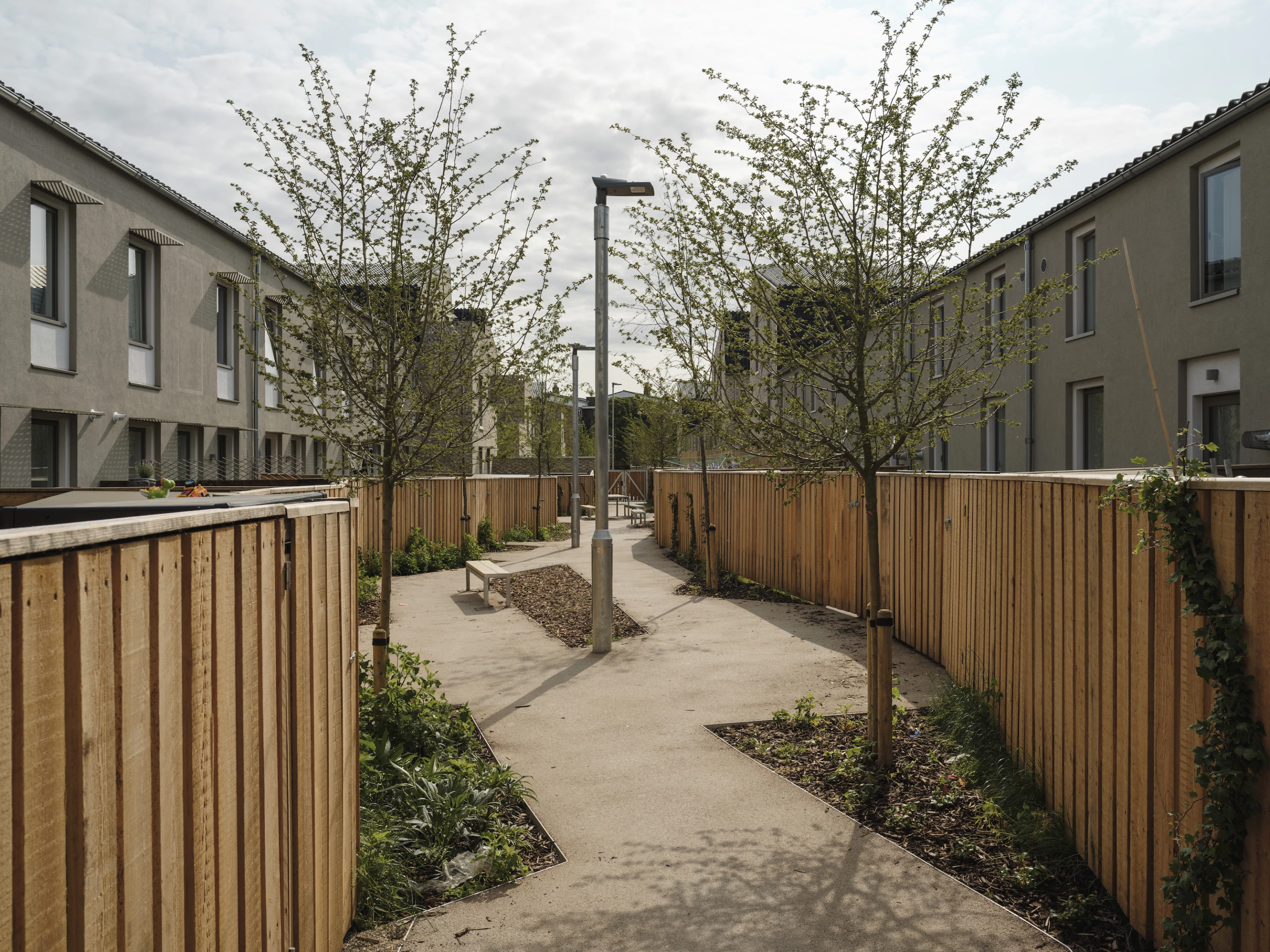 Goldsmith Street's homes share a secure alleyway for children to meet and play together