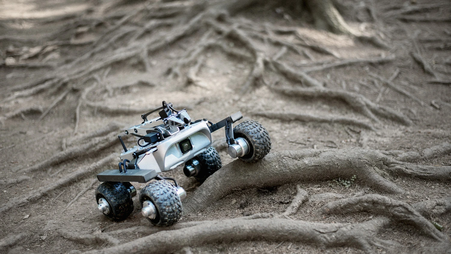 The Turtle Rover uses its NASA-inspired suspension to take on some roots