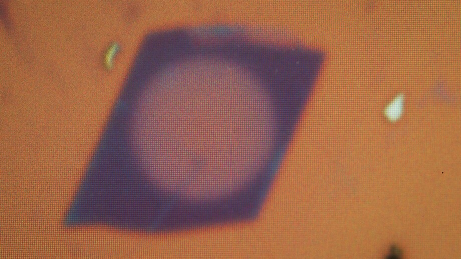 The world’s thinnest lens (purple circle) is made from molybdenum disulphide crystal and measures just 6.3 nanometers thick