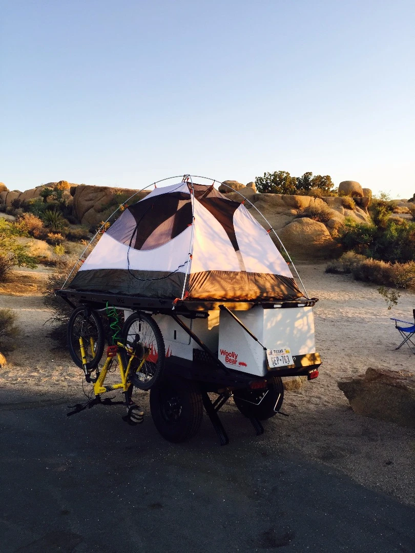 In place of the teardrop cabin or roof-top tent, the WoollyBear offers space for a two-person ground tent