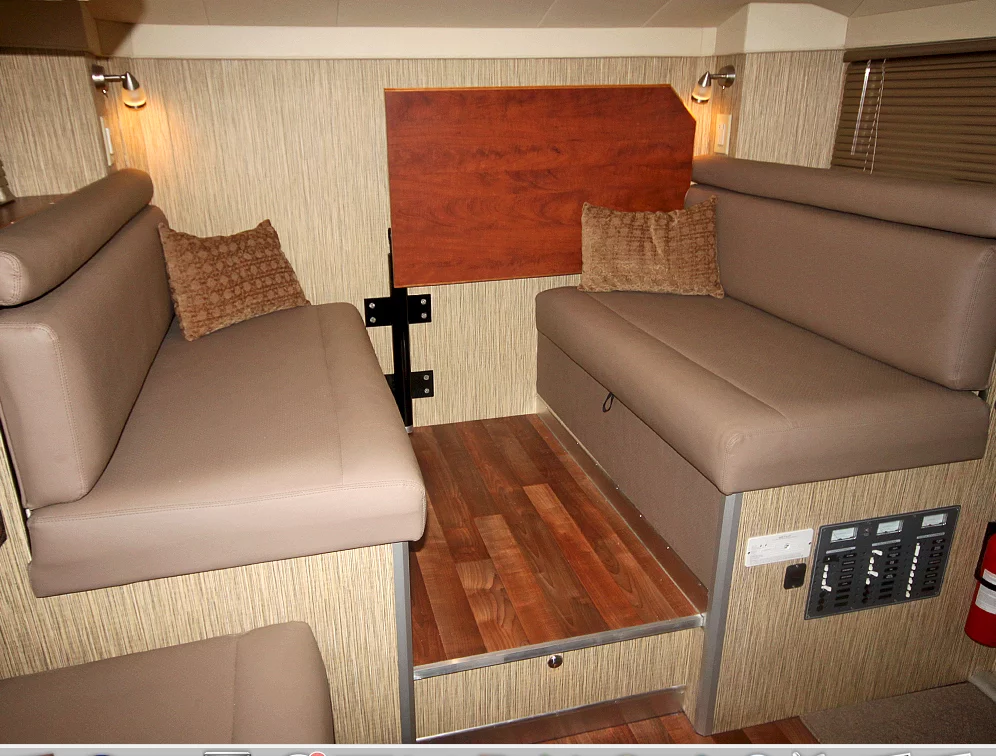 The table folds out of the way for bed conversion