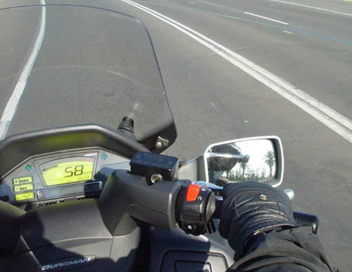 Riding the Burgman is ridicuously good fun. The 650 twin has enough power to ensure a surfeit in any roadgoing situation. It's not all that long ago that Triumph's 650 twin was considered the king of the road. Now a similar motor with a similar power spread powers a scooter.