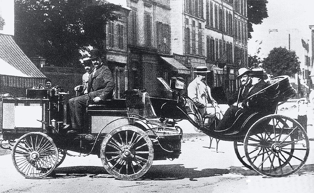 The winner of the first motorsport event in history was a De Dion Bouton steam car pulling a trailer and driven by Count De Dion himself. The race ran over a 78 mile (126 km) route from Paris to Rouen of 22 July 1894, and though he was the first car across the finishing line, he was disqualified because the car required a stoker (someone to tend the boiler). De Dion's time for the distance was 6 hours 48 minutes giving him an average speed of 19 km/h (12 mph).