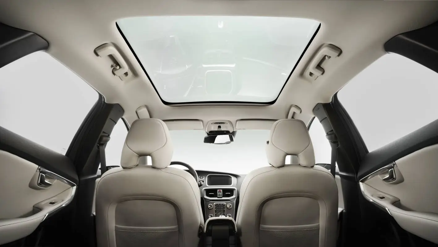 The interior of the Volvo V40 features a fixed panorama glass roof that stretches from the front windscreen to the backrest of the rear seats