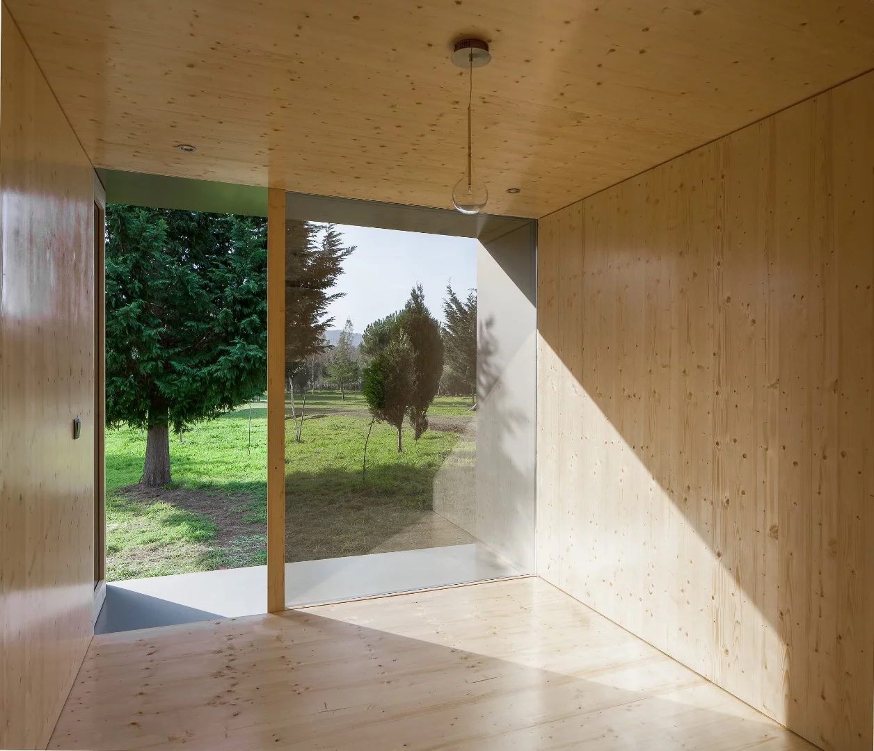 The home is clad in aluminum but if you peeled back its layers like an onion, you'd find a sandwich panel that includes CLT (cross-laminated timber) and insulation