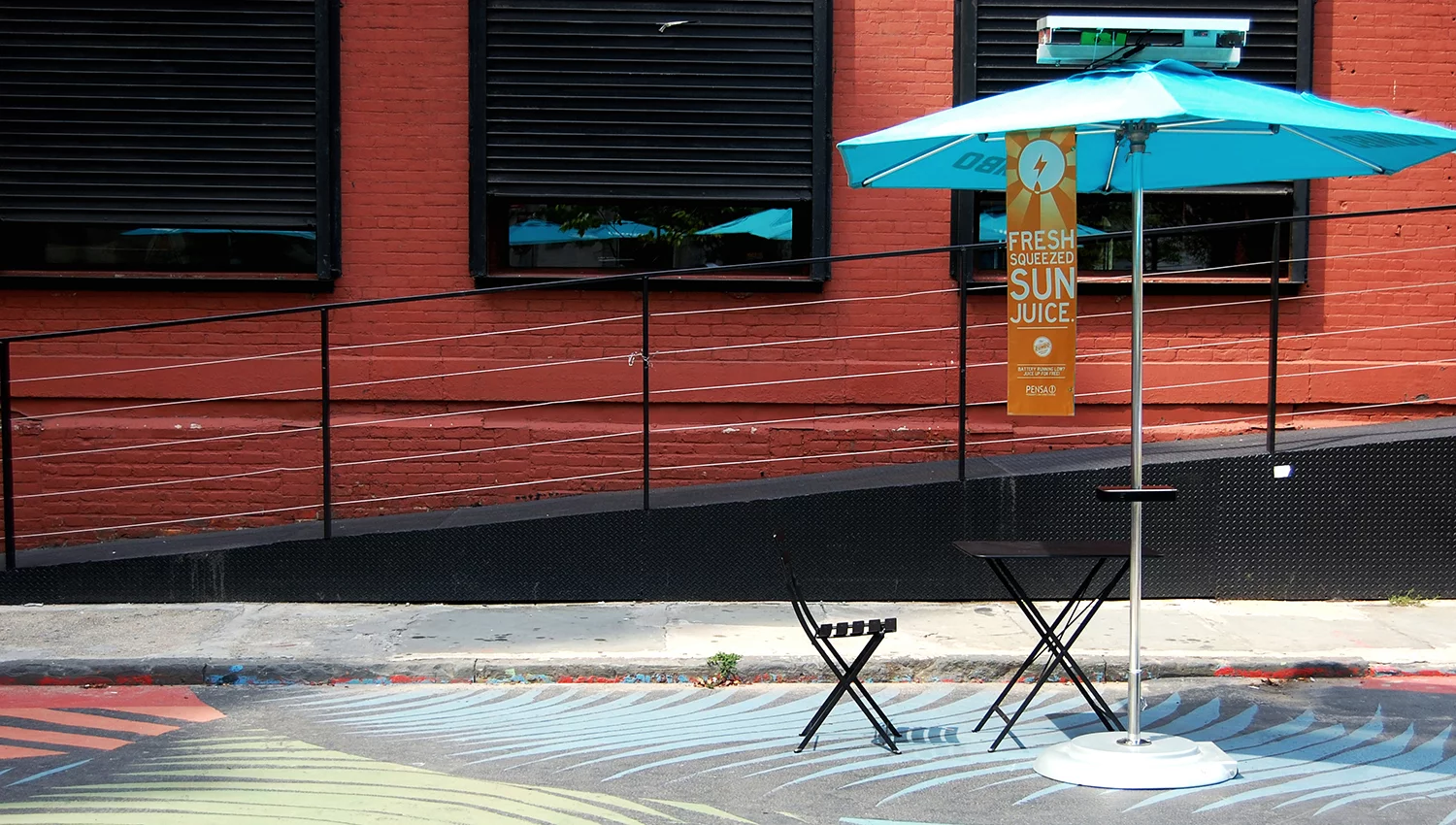 The Pensa cafe umbrella prototype waiting to charge up mobile devices via PV panels on top