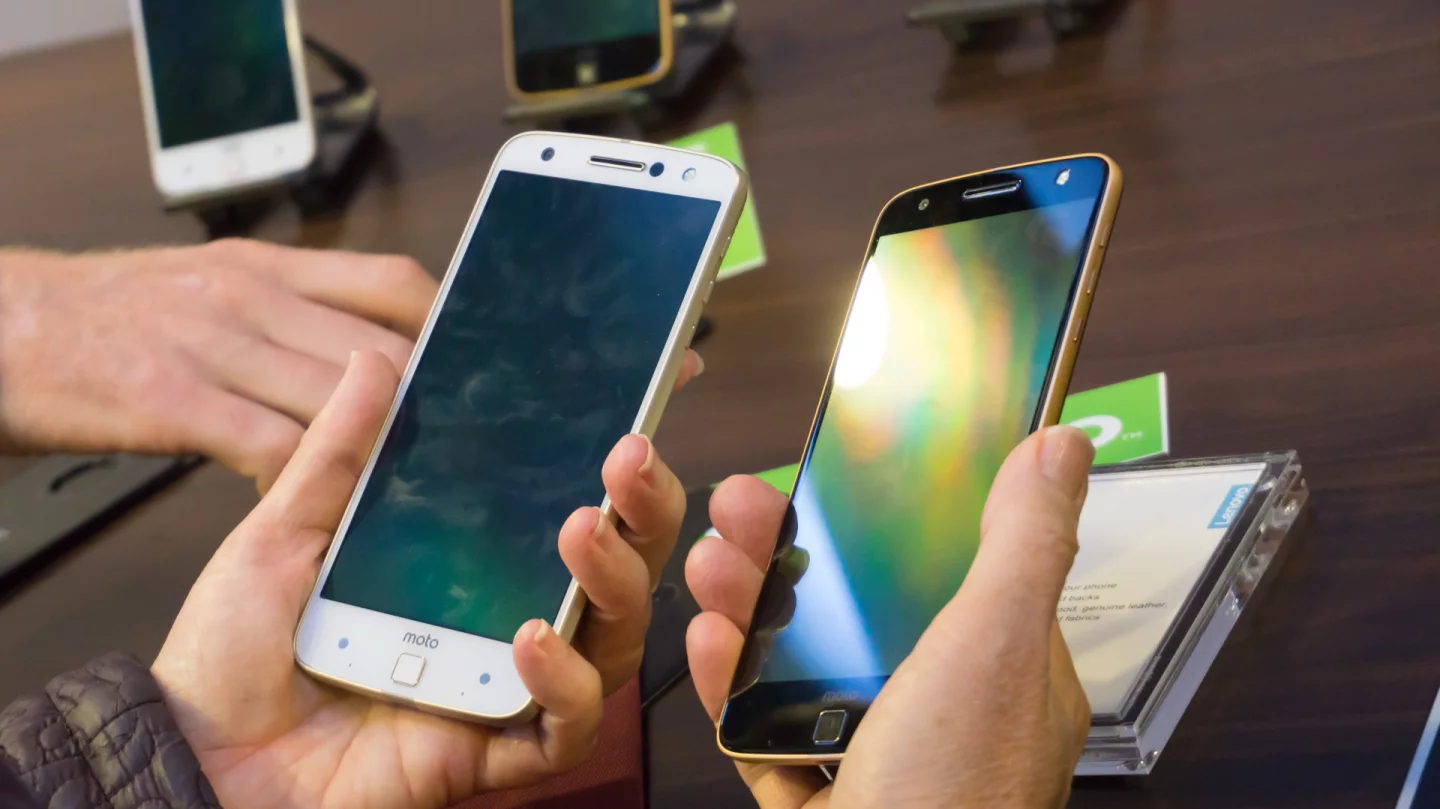 Two Moto Z phones in hand