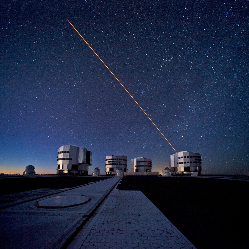 SPHERE is attached to Unit 3 of the VLT, with all four units as well as the four auxiliary telescopes that comprise the VLT captured in this photo (Photo: ESO/S. Brunier)