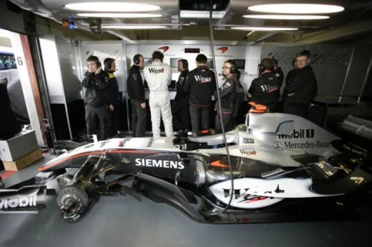 The tension is obvious as Raikkonen awaits his turn in qualifying.