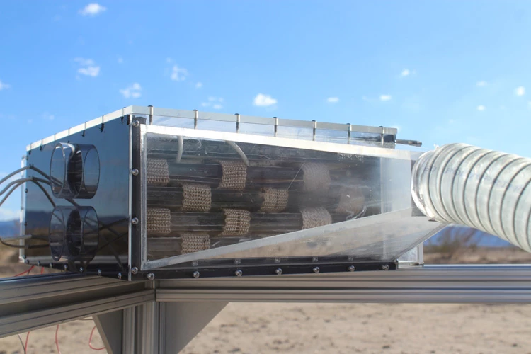 The water harvester is made up of a fan that blows air over cartridges of metal-organic frameworks inside a box, which collect water and release it into a condenser.