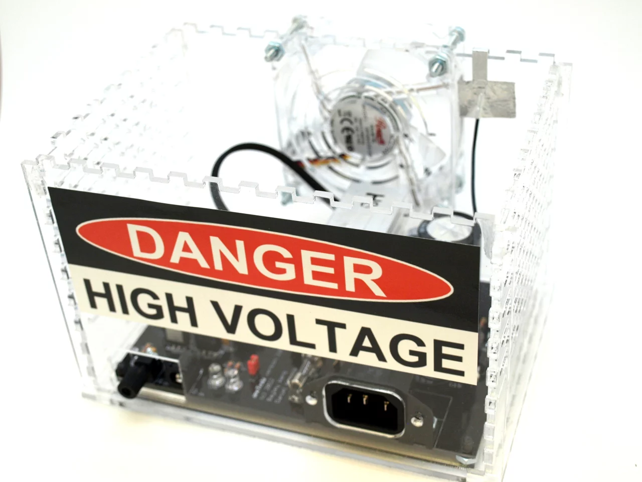 Each device is made up of a driver board that sits inside the laser cut acrylic main chassis and powers the whole Tesla coil