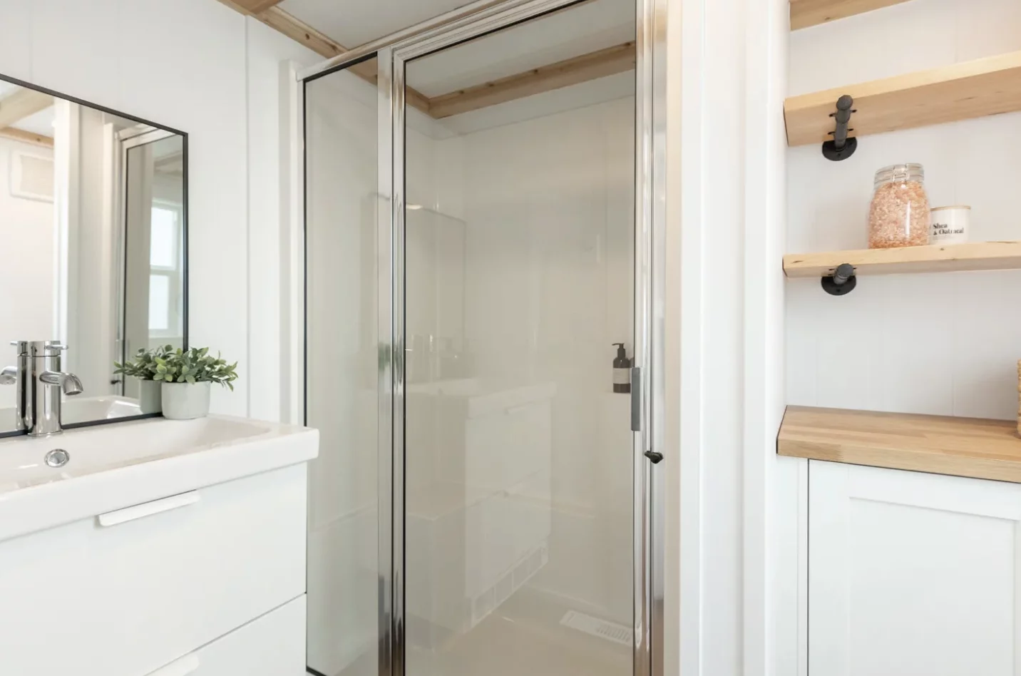 The Loft Ruby Edition's bathroom includes a toilet, shower, and a vanity sink, plus some storage space