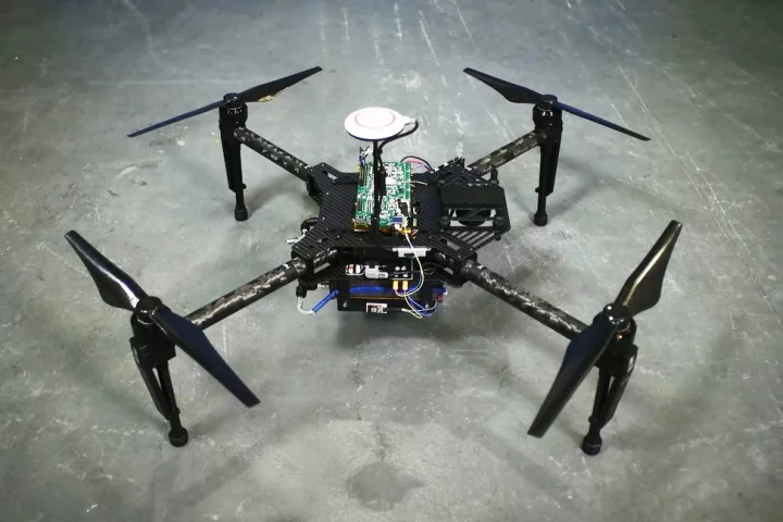 A quadcopter drone, equipped with a prototype of the range extender