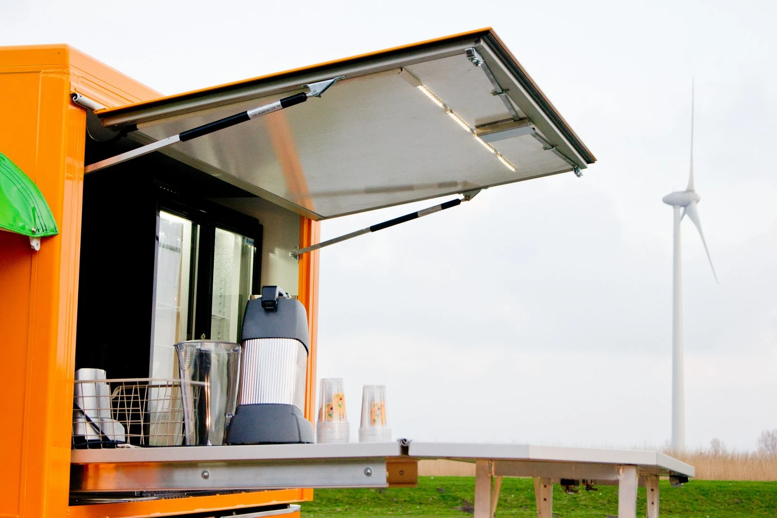 The Vendo features an opening side panel, that reveals its serving station