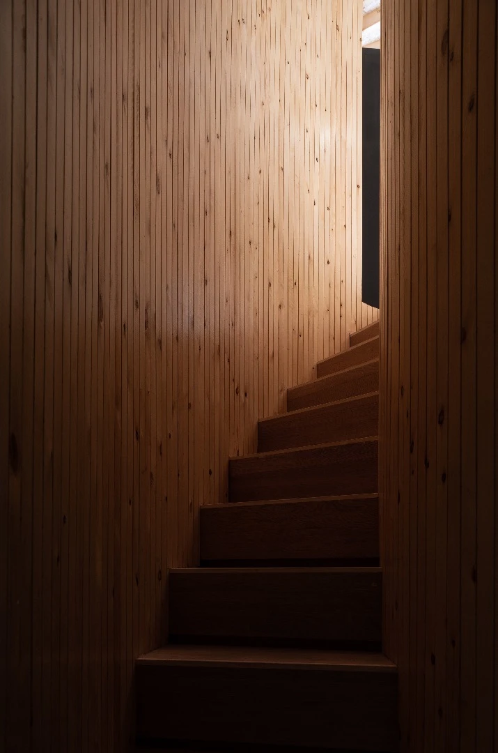 A spiral staircase leads to the Treewow Villa O's rooftop terrace area